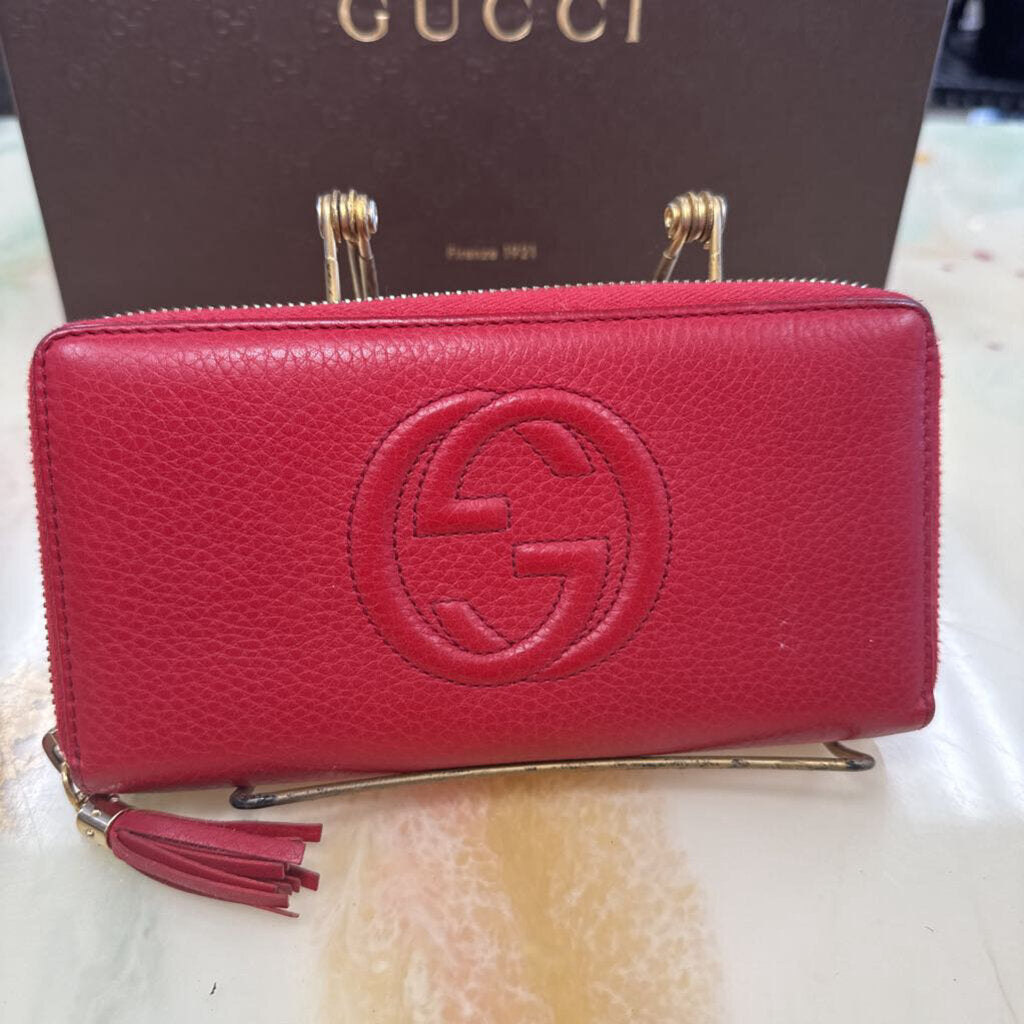 Red soho interlocking tassel zip around wallet