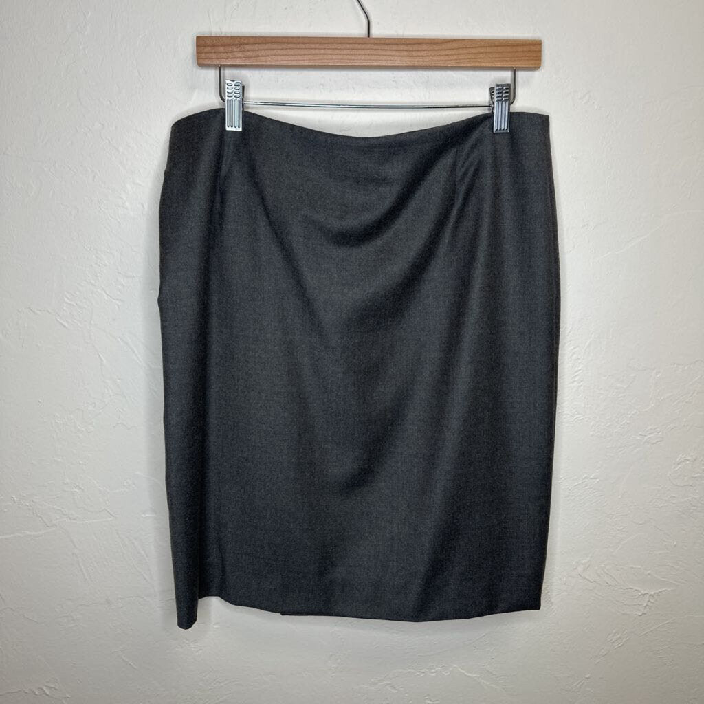 Mid length virgin wool skirt with leather belt accent